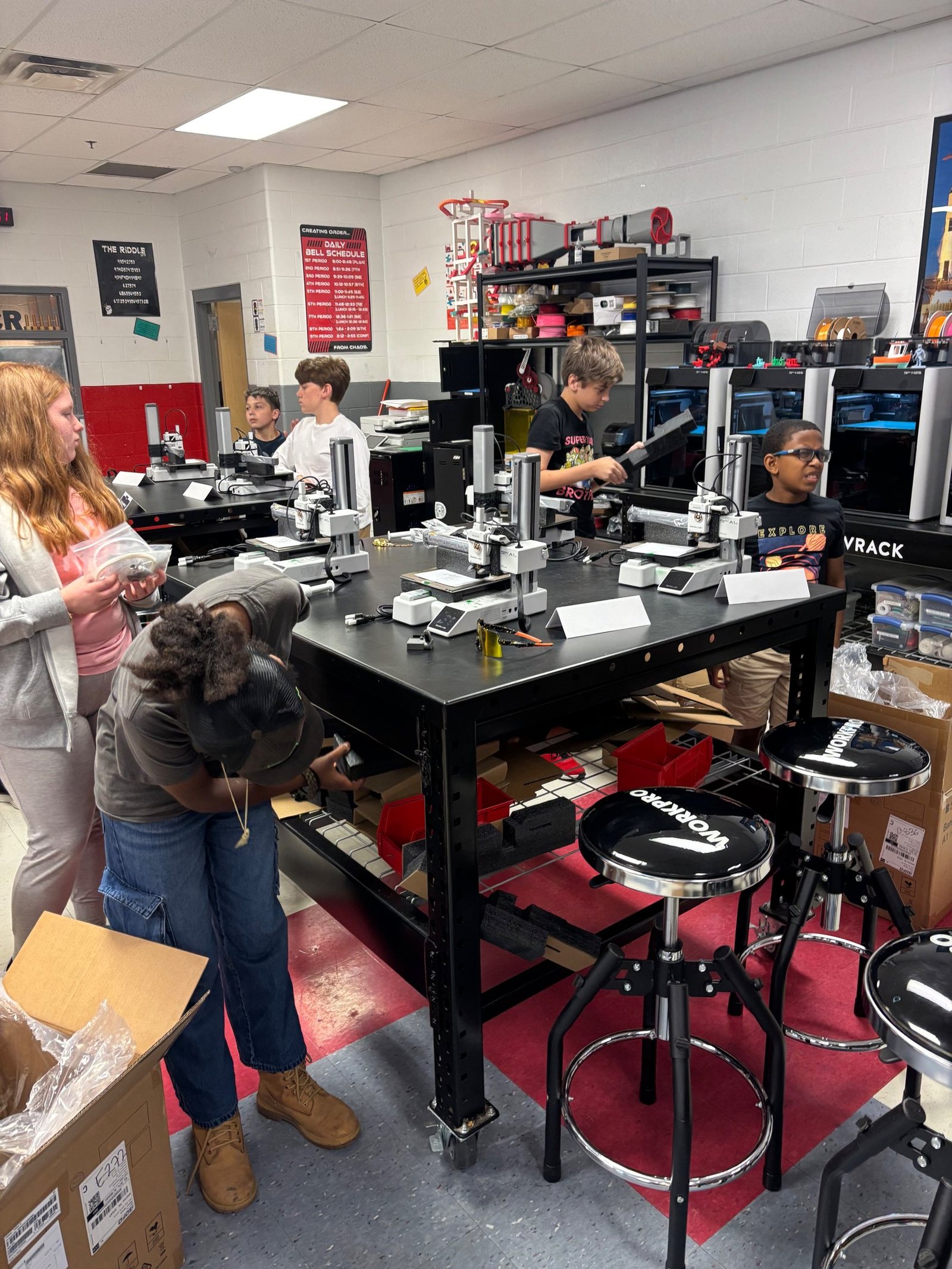 Row of 3D printers set up during STEMWISE 3D Printing Camp