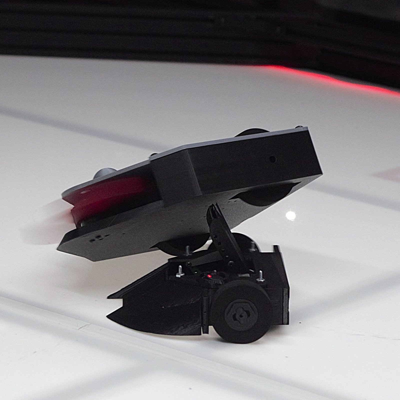 A Kilobots combat robot airborne mid-match