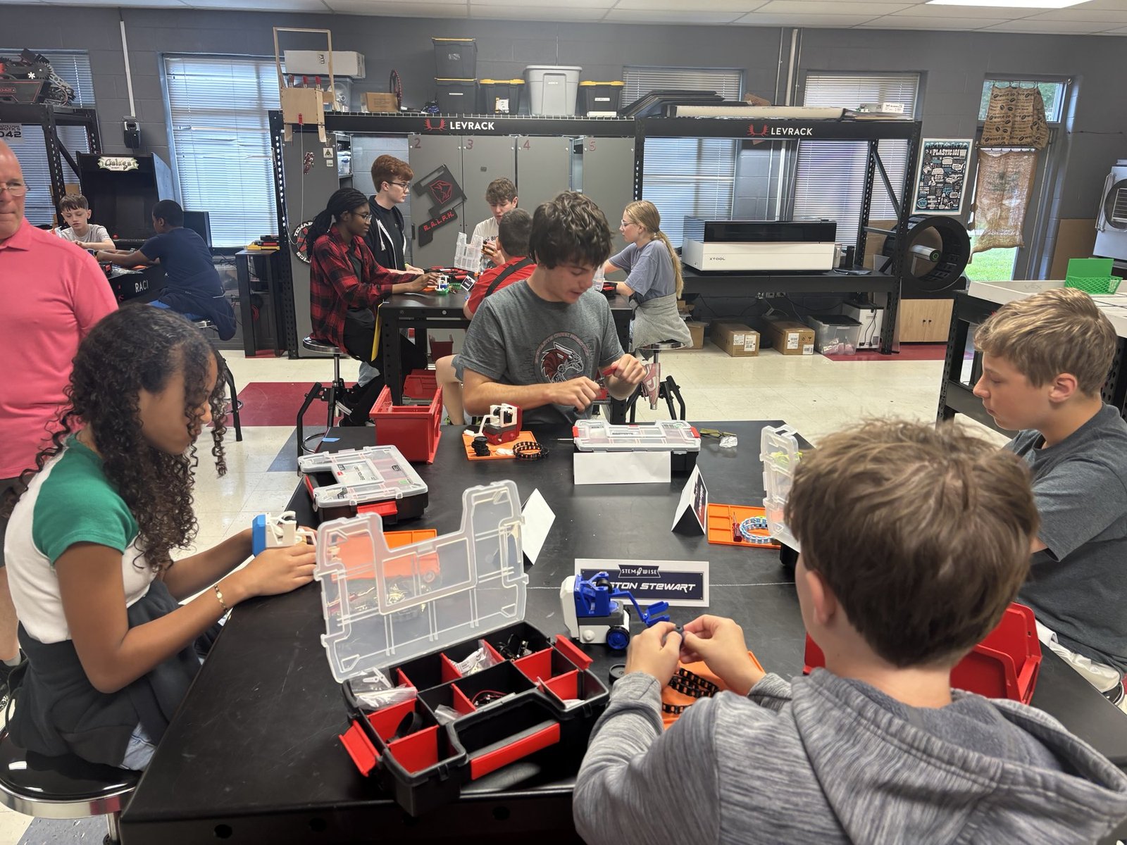 Students working through a classroom STEM build